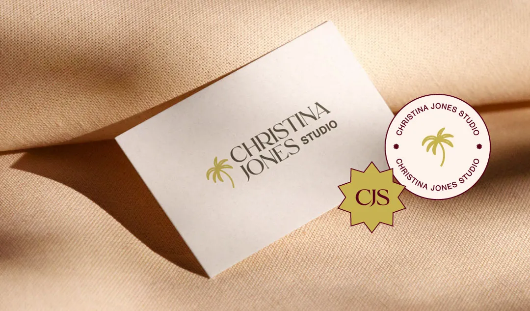 photo of a business card featuring the logo, with logo variations collaged on top